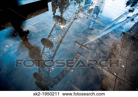 Stock Image - Creative POV of London Eye reflected on the floor, London, UK. Fotosearch