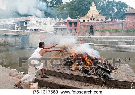 cremation ceremony on the Bagmati River at the Pahsupatinath Temple in Kathmandu, Nepal View Large Photo Image Stock Photo - cremation ceremony on the Bagmati River at the Pahsupatinath Temple in Kathmandu, Nepal. Fotosearch