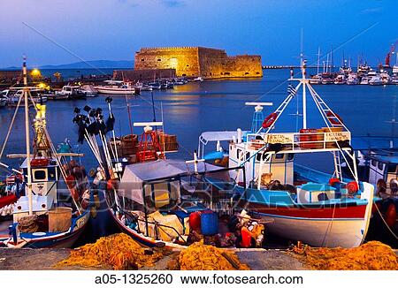 Cretan boat moored Heraklion harbour and Venetian fortress Koules Castle, Iraklio, Crete, Greece. View Large Photo Image Stock Image - Cretan boat moored Heraklion harbour and Venetian fortress Koules Castle, Iraklio, Crete, Greece.. Fotosearch