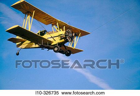 Stock Photography - Crop duster approaches for landing at an airstrip just North of Oaksdale. Withman County, Washington, USA. Fotosearch