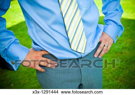 Cropped view of well-dressed man with hands on hips View Large Photo Image Picture - Cropped view of well-dressed man with hands on hips. Fotosearch