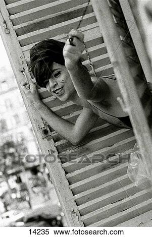 Cross dresser appearing in european window View Large Photo Image Stock Photography - Cross dresser appearing in european window. Fotosearch