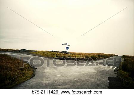 Cross on mountain road with a signpost indicating to go to Kirkby Malham 2, and Airton 3 in Yorkshire Dales, England, UK, Europe. View Large Photo Image Stock Photograph - Cross on mountain road with a signpost indicating to go to Kirkby Malham 2, and Airton 3 in Yorkshire Dales, England, UK, Europe.. Fotosearch