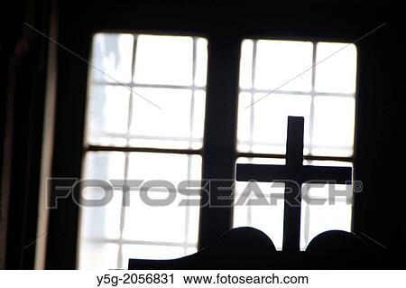 Stock Image - cross on top of confessional box in church in rome italy.. Fotosearch