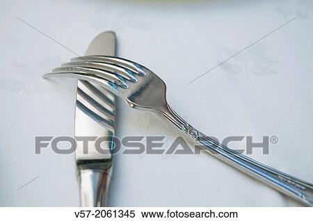 Crossed fork and knife. Close view. View Large Photo Image Stock Photography - Crossed fork and knife. Close view.. Fotosearch