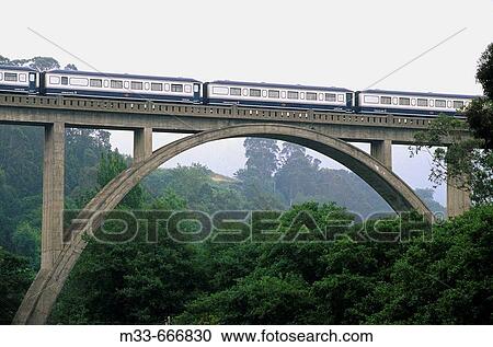 Crossing a bridge in Luarca. Asturias. Transcantabrian train through the north of Spain View Large Photo Image Stock Image - Crossing a bridge in Luarca. Asturias. Transcantabrian train through the north of Spain. Fotosearch