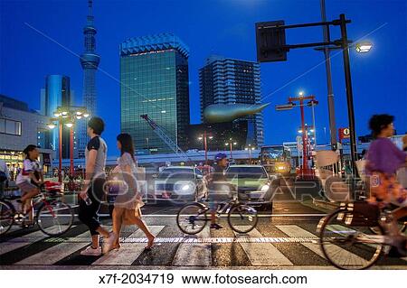 Crosswalk in Kaminarimon street, in background Sky Tree and Asahi building, Asakusa District, Tokyo, Japan. View Large Photo Image Stock Photo - Crosswalk in Kaminarimon street, in background Sky Tree and Asahi building, Asakusa District, Tokyo, Japan.. Fotosearch