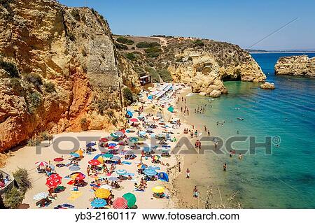Stock Photo - Crowded Beach, Lagos, Algarve, Portugal.. Fotosearch