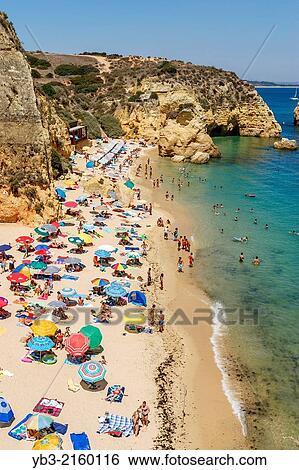 Stock Photograph - Crowded Beach, Lagos, Algarve, Portugal.. Fotosearch