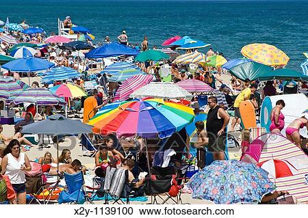 Crowded summer beach with colorful umbrellas, Nauset Beach, Cape Cod National Seashore, Cape Cod, MA View Large Photo Image Stock Image - Crowded summer beach with colorful umbrellas, Nauset Beach, Cape Cod National Seashore, Cape Cod, MA. Fotosearch