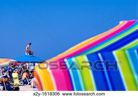 Crowded summer beach with colorful umbrellas, Nauset Beach, Cape Cod National Seashore, Cape Cod, MA, Massachusetts, USA View Large Photo Image Stock Photograph - Crowded summer beach with colorful umbrellas, Nauset Beach, Cape Cod National Seashore, Cape Cod, MA, Massachusetts, USA. Fotosearch