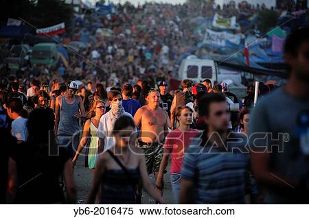 Crowds walking around the main campsite during the Przystanek Woodstock Music festival in Kostrzyn, Poland. View Large Photo Image Stock Photography - Crowds walking around the main campsite during the Przystanek Woodstock Music festival in Kostrzyn, Poland.. Fotosearch
