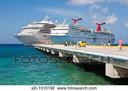 Cruise ship passengers on pier disembarking from Carnival cruise ships Triumph and Ecstasy in Cozumel, Mexico in the Caribbean Sea View Large Photo Image Stock Image - Cruise ship passengers on pier disembarking from Carnival cruise ships Triumph and Ecstasy in Cozumel, Mexico in the Caribbean Sea. Fotosearch