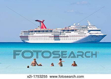 Cruise ship passengers play in water while ship is moored at Half Moon Cay, Bahamas View Large Photo Image Stock Photography - Cruise ship passengers play in water while ship is moored at Half Moon Cay, Bahamas. Fotosearch