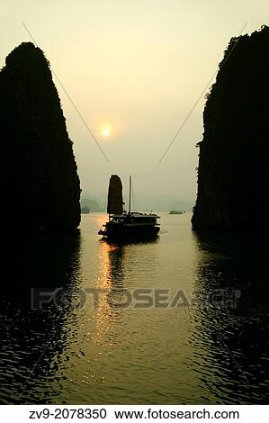 Cruising Halong Bay in a junk is one of Vietnam's musts, as you can choose luxury boats with antique accommodations and five star food, or a budget backpacker boat View Large Photo Image Stock Image - Cruising Halong Bay in a junk is one of Vietnam's musts, as you can choose luxury boats with antique accommodations and five star food, or a budget backpacker boat. Fotosearch