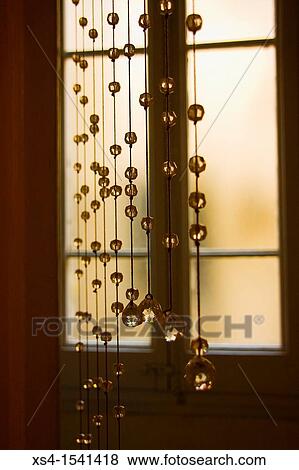 Crystal beaded curtain in front of a window. View Large Photo Image Stock Photo - Crystal beaded curtain in front of a window.. Fotosearch