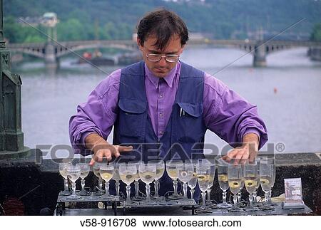 CRYSTAL HARP PLAYER, CHARLES BRIDGE, PRAGUE, CZECH REPUBLIC View Large Photo Image Stock Photo - CRYSTAL HARP PLAYER, CHARLES BRIDGE, PRAGUE, CZECH REPUBLIC. Fotosearch