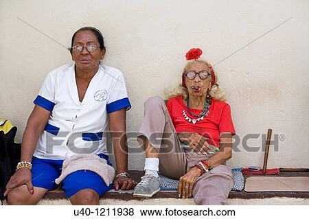 Cuba, friends smoking cigars View Large Photo Image Stock Photo - Cuba, friends smoking cigars. Fotosearch