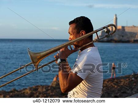 Cuba, Habana Vieja, musician at sunset View Large Photo Image Stock Photo - Cuba, Habana Vieja, musician at sunset. Fotosearch