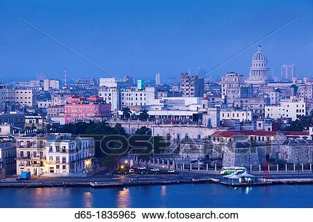 Cuba, Havana, Havana Vieja, elevated view of buildings along Havana Bay, dawn View Large Photo Image Stock Photography - Cuba, Havana, Havana Vieja, elevated view of buildings along Havana Bay, dawn. Fotosearch