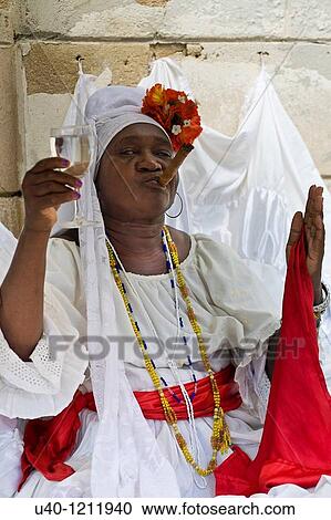 Stock Image - Cuba, Havana, Santeria Priestess. Fotosearch