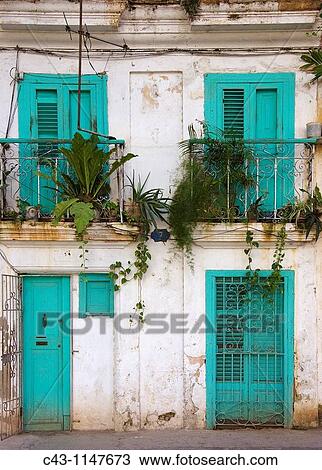 Cuba - Many buildings and their fa? ades in Cuba's capital Havana are in quite a bad state View Large Photo Image Stock Image - Cuba - Many buildings and their fa? ades in Cuba's capital Havana are in quite a bad state. Fotosearch