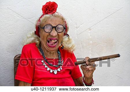 Cuba, Old woman smoking cigar View Large Photo Image Stock Photo - Cuba, Old woman smoking cigar. Fotosearch