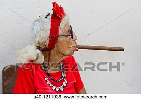 Cuba, old woman smoking cigar View Large Photo Image Stock Photograph - Cuba, old woman smoking cigar. Fotosearch