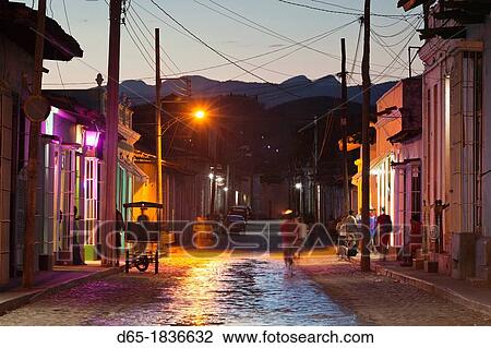 Stock Image - Cuba, Sancti Spiritus Province, Trinidad, street view, dusk. Fotosearch