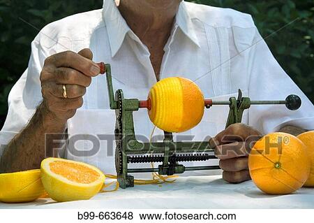 CUBAN MAN PEELING ORANGES MIAMI, FLORIDA USA View Large Photo Image Stock Photo - CUBAN MAN PEELING ORANGES MIAMI, FLORIDA USA. Fotosearch