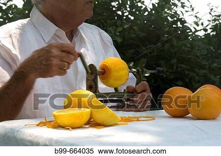 CUBAN MAN PEELING ORANGES MIAMI, FLORIDA USA View Large Photo Image Stock Photography - CUBAN MAN PEELING ORANGES MIAMI, FLORIDA USA. Fotosearch