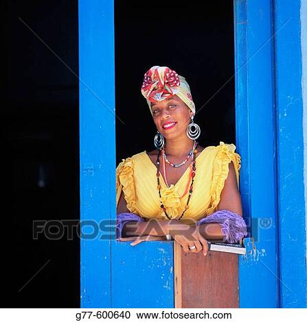 Stock Image - Cuban woman with typical dress. Old Havana. Cuba. Fotosearch