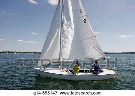 Stock Photo - Culver Academy sailing students, sailboat. Lake Maximkuckee. Culver. Indiana. USA.. Fotosearch