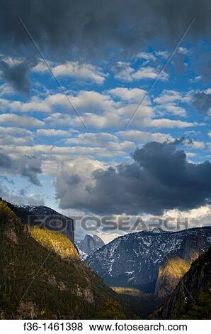 Cumulus clouds in spring over El Capitan and Half Dome, Yosemite Valley, Yosemite National Park, California View Large Photo Image Stock Photo - Cumulus clouds in spring over El Capitan and Half Dome, Yosemite Valley, Yosemite National Park, California. Fotosearch
