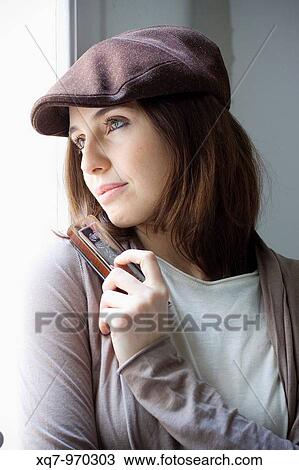 Stock Image - Cup, Harmonica gir, music, Music. Fotosearch