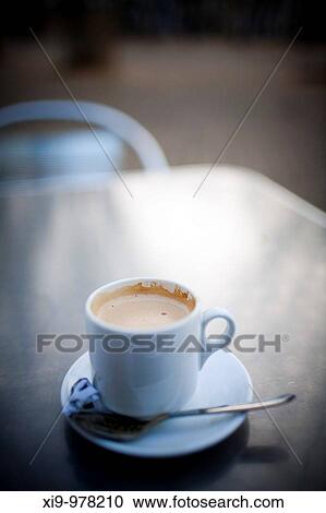 Cup of coffee on a outdoor table, Seville, Spain View Large Photo Image Stock Image - Cup of coffee on a outdoor table, Seville, Spain. Fotosearch