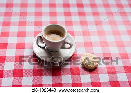 Cup of espresso and a biscuit View Large Photo Image Stock Photo - Cup of espresso and a biscuit. Fotosearch