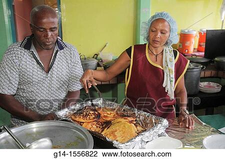 Cura? ao, Netherlands Antilles, Dutch, Willemstad, Punda, De Ruyterkade, Plasa Bieu, Old Market, vendor, kitchen, tray, Black, woman, man, hairnet, apron, server, Funchi, typical food, restaurant, View Large Photo Image Stock Image - Cura? ao, Netherlands Antilles, Dutch, Willemstad, Punda, De Ruyterkade, Plasa Bieu, Old Market, vendor, kitchen, tray, Black, woman, man, hairnet, apron, server, Funchi, typical food, restaurant,. Fotosearch