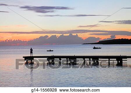 Cura? ao, Netherlands Antilles, Dutch, Piscadera Bay, Caribbean Sea, pier, man, standing, boat, coastline, sunset, twilight, pink cloud, silhouette, fishing, fisherman, boat, View Large Photo Image Stock Photo - Cura? ao, Netherlands Antilles, Dutch, Piscadera Bay, Caribbean Sea, pier, man, standing, boat, coastline, sunset, twilight, pink cloud, silhouette, fishing, fisherman, boat,. Fotosearch