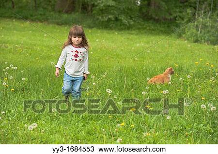 Cure girl with her cat exploring in a field in Indiana, USA View Large Photo Image Stock Image - Cure girl with her cat exploring in a field in Indiana, USA. Fotosearch