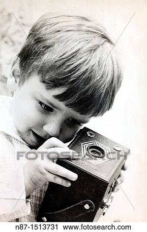 Stock Image - curiosity of a child&39, s old camera. Fotosearch
