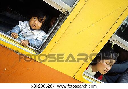 Curious kid and his mother in the train to Machu Pichu. Peru View Large Photo Image Stock Photo - Curious kid and his mother in the train to Machu Pichu. Peru. Fotosearch