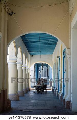 Customers sitting at the outdoor patio tables of a cafe on Parque Jose Marti, Cienfuegos, Cuba View Large Photo Image Stock Photo - Customers sitting at the outdoor patio tables of a cafe on Parque Jose Marti, Cienfuegos, Cuba. Fotosearch