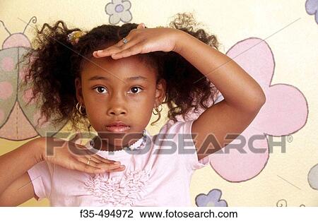 Cute African American girl frames face with hands View Large Photo Image Stock Image - Cute African American girl frames face with hands. Fotosearch