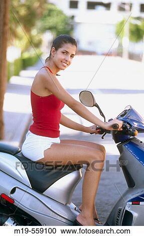 cute girl on a scooter View Large Photo Image Stock Image - cute girl on a scooter. Fotosearch