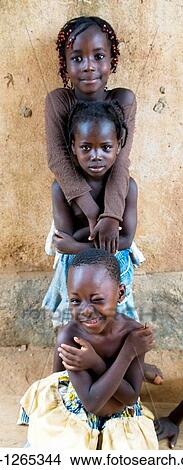 Cute girls playing together in Ouagadougou, Burkina Faso View Large Photo Image Picture - Cute girls playing together in Ouagadougou, Burkina Faso. Fotosearch