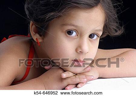 Cute little girl in a thoughtful mood View Large Photo Image Stock Image - Cute little girl in a thoughtful mood. Fotosearch