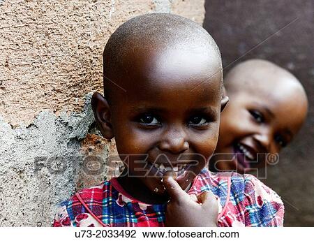 Cute Tanzanian girls in their village. View Large Photo Image Stock Image - Cute Tanzanian girls in their village.. Fotosearch