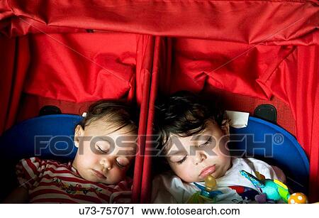 Cute twins fast asleep View Large Photo Image Stock Image - Cute twins fast asleep. Fotosearch