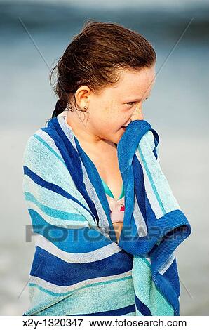 Cute young girl drying off with a beach towel, Cape Cod, MA View Large Photo Image Stock Photo - Cute young girl drying off with a beach towel, Cape Cod, MA. Fotosearch